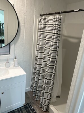 Combined shower/tub, hair dryer, towels, soap