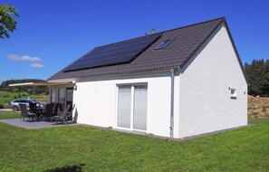 Enjoy a peaceful stay in this charming house with a covered patio and outdoor furniture.