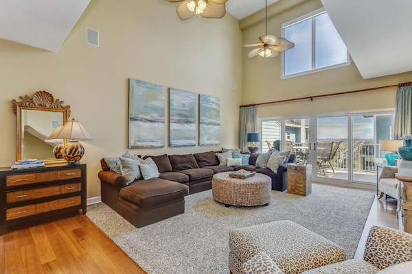 Expansive 2 story family room with views of the Gulf