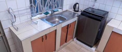 Fridge, microwave, electric kettle, cookware/dishes/utensils