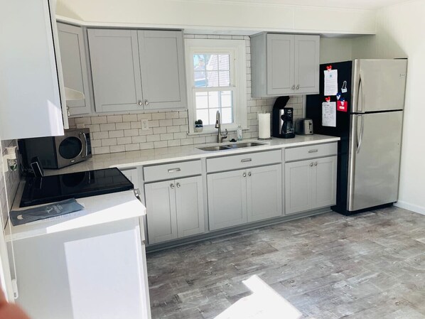 Fridge, coffee/tea maker, cookware/dishes/utensils