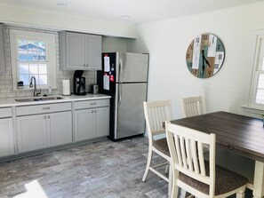 Fridge, coffee/tea maker, cookware/dishes/utensils