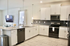 House, Multiple Beds | Private kitchen | Dining tables - Villa Serene by Fairytale VR (Davenport)