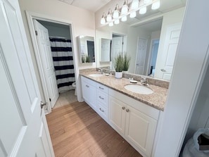 Combined shower/tub, hair dryer, towels, toilet paper