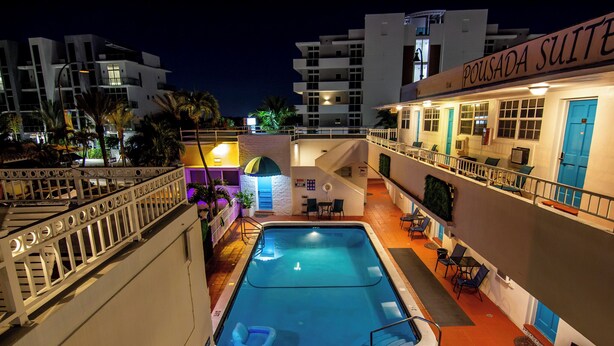 A rooftop pool area with a 3 FT pool, outdoor seating, and a building labeled "POUSADA SUITE". - Pousada Suites at Hollywood Beach (Hollywood)