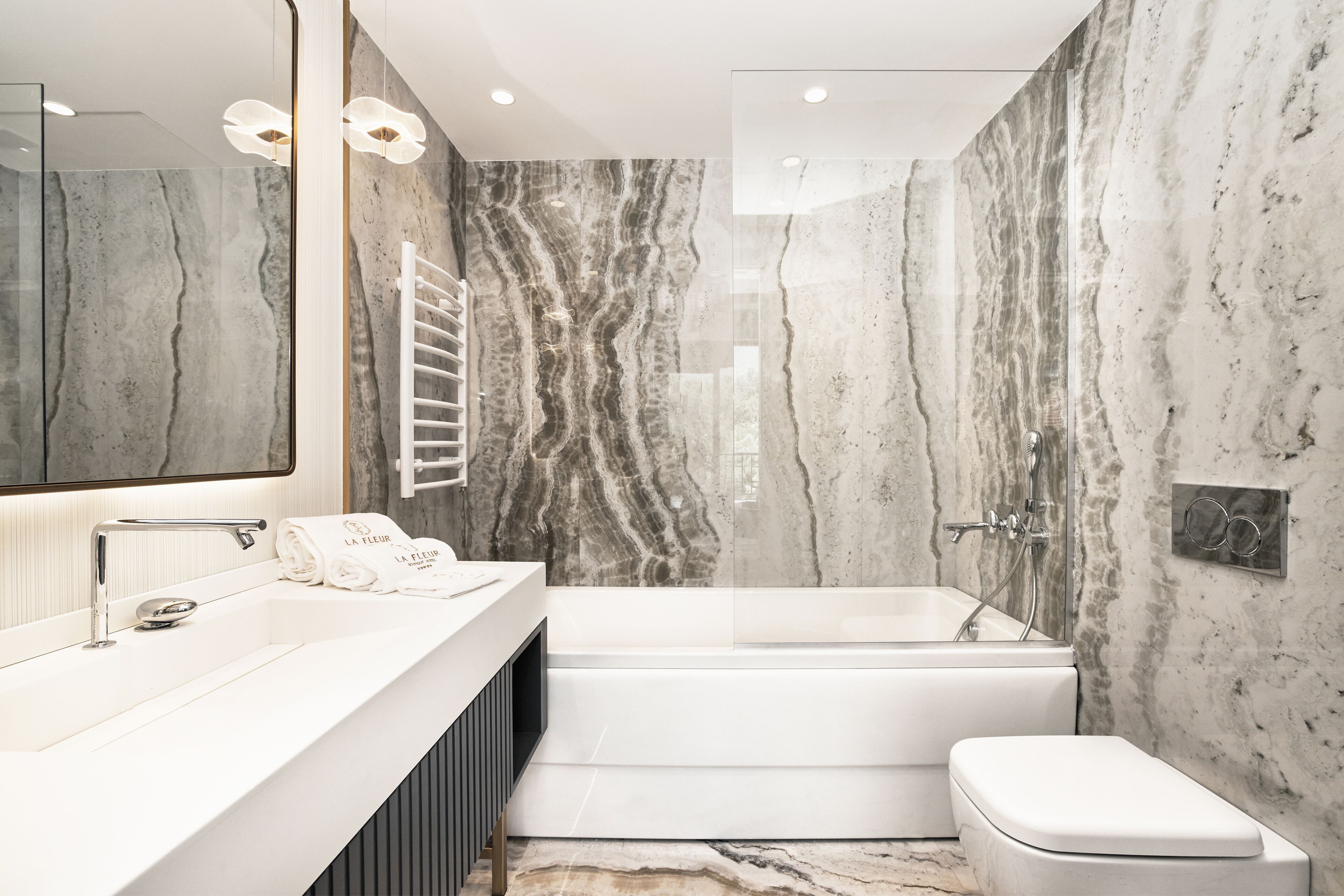 designer toiletries, hair dryer, dressing gowns, slippers