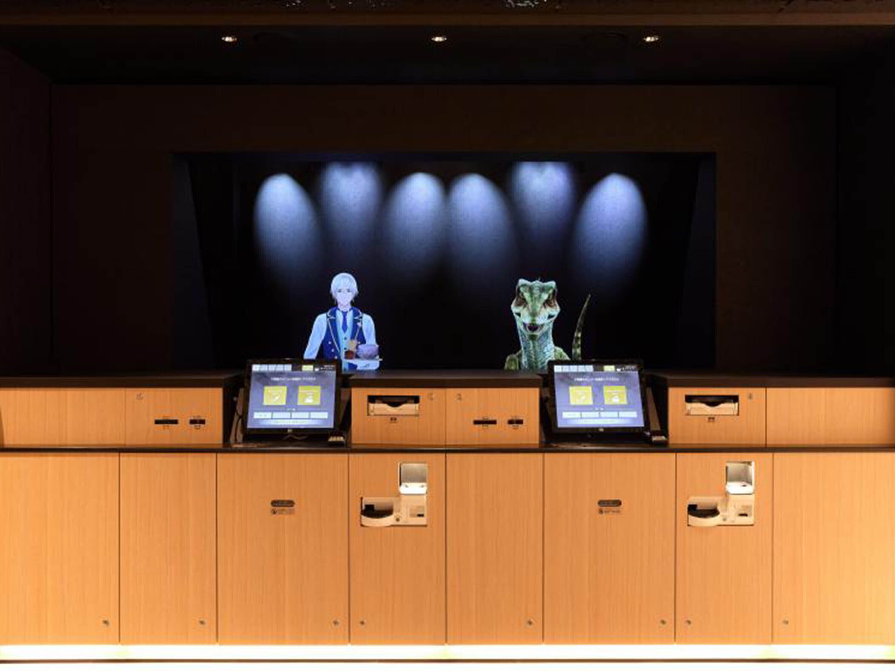 A reception desk with a digital display, a uniformed attendant, and a dinosaur figure.