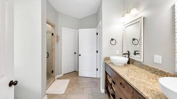 Combined shower/bathtub, hair dryer, towels, soap