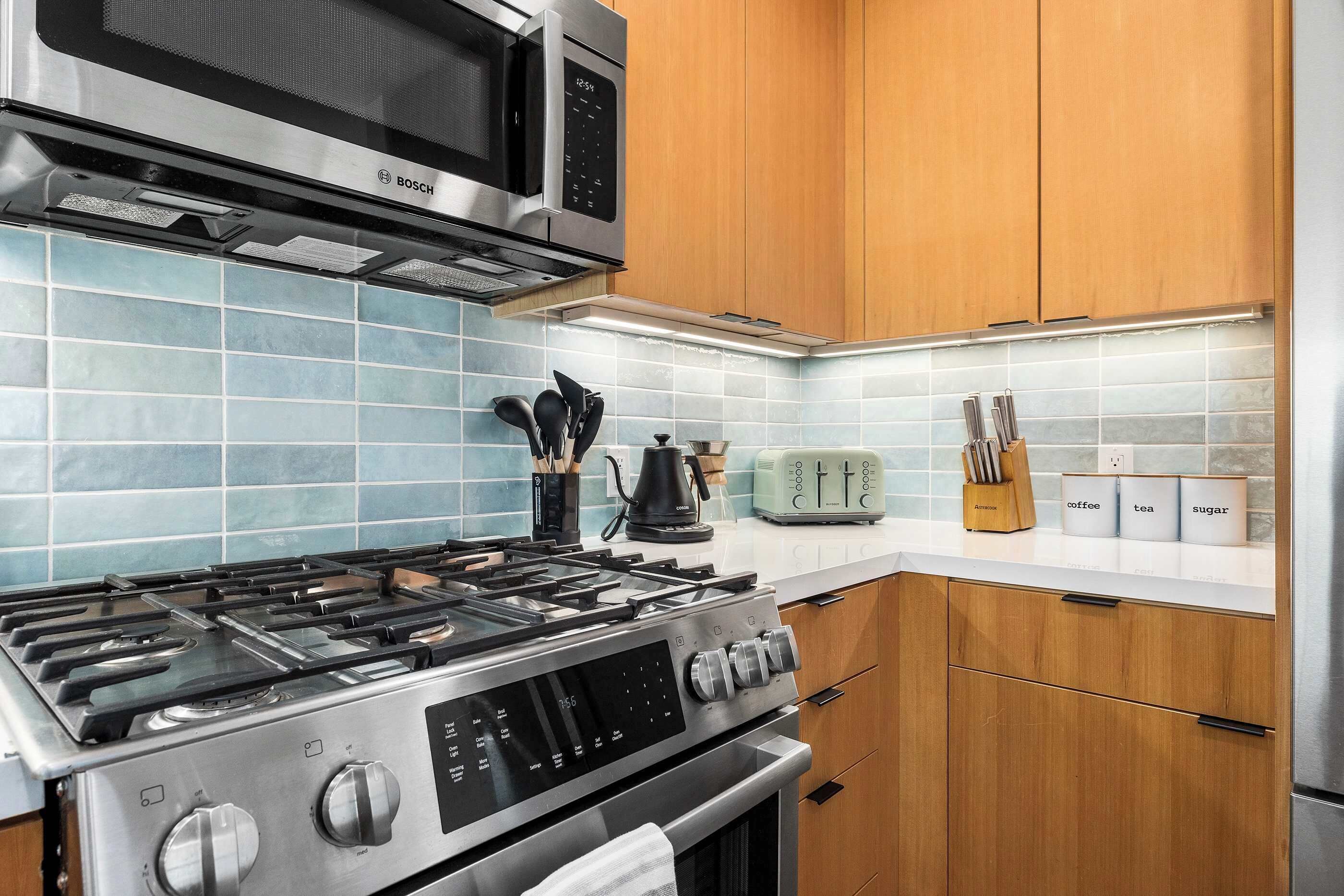 Coffee/tea maker, fridge, microwave, oven