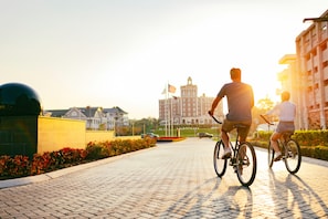A paved pathway with a brick pattern, flanked by buildings and greenery. - Embassy Suites by Hilton Virginia Beach Oceanfront Resort (Virginia Beach)