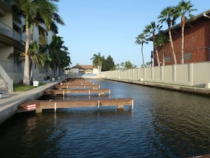 Guests can enjoy serene waterfront views from the hotel's contemporary buildings, featuring balconies and access to the marina.