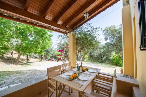 Green Walnut Home in Ano Korakiana is surrounded by nature on a quiet area.