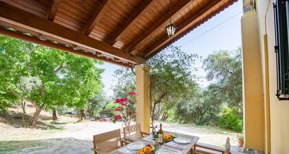 Green Walnut Home in Ano Korakiana is surrounded by nature on a quiet area.