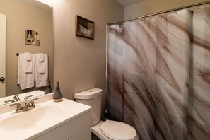 Combined shower/tub, hair dryer, towels, soap