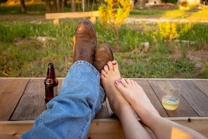 Guests can sit and enjoy a refreshing drink in a serene outdoor setting.