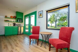 Fridge, microwave, coffee/tea maker, cookware/dishes/utensils