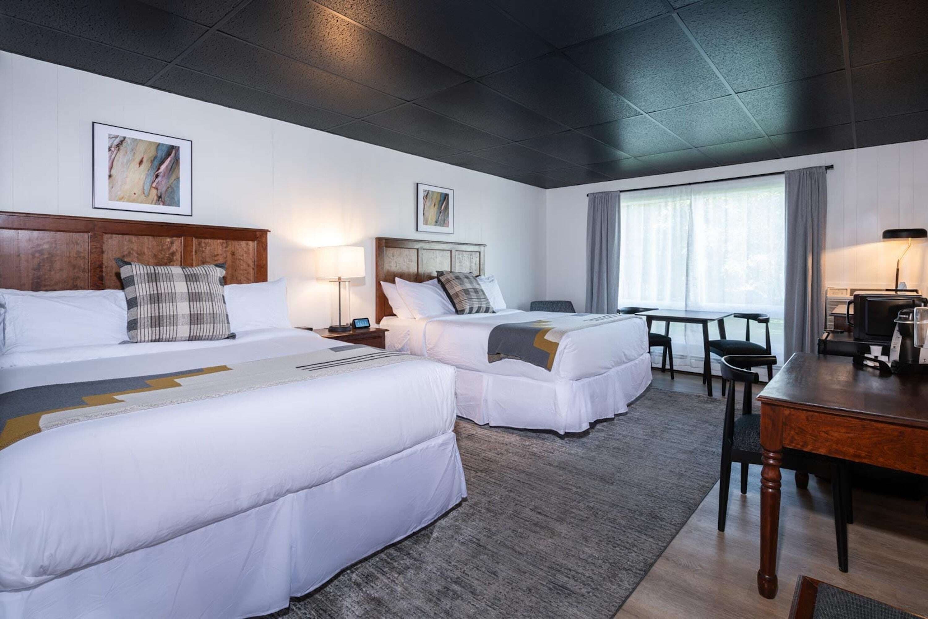 deluxe room, 2 queen beds | blackout curtains, iron/ironing board, free wifi, bed sheets