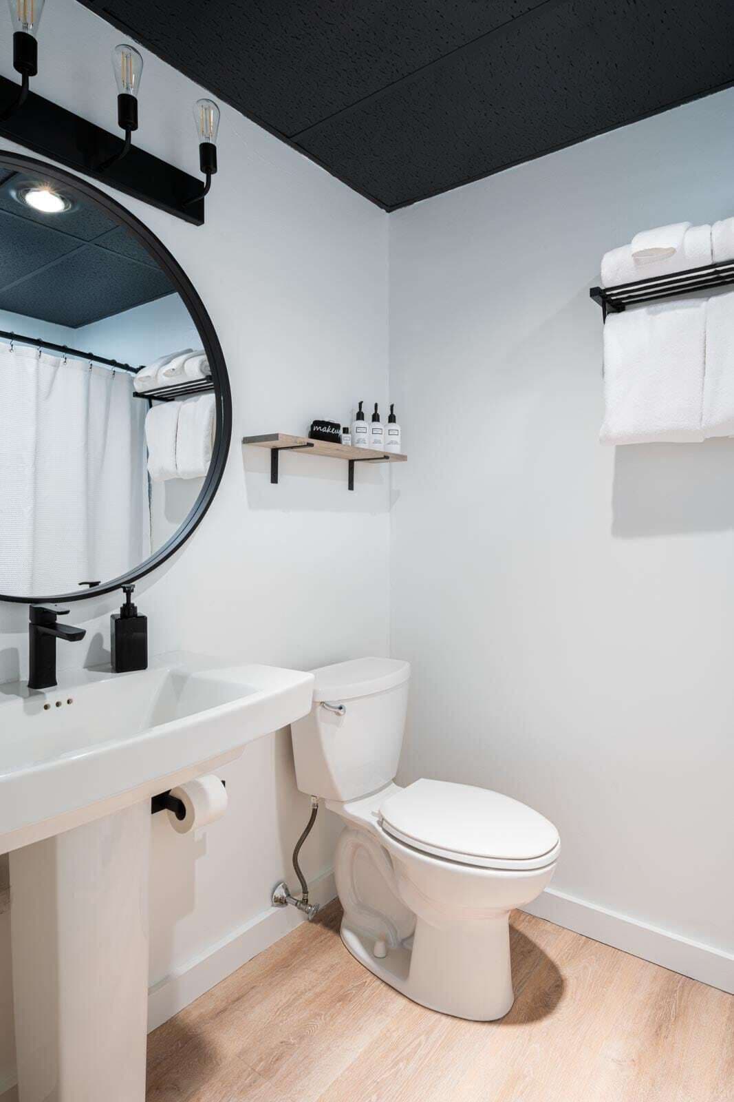 deluxe studio suite | bathroom | separate bathtub and shower, hair dryer, towels