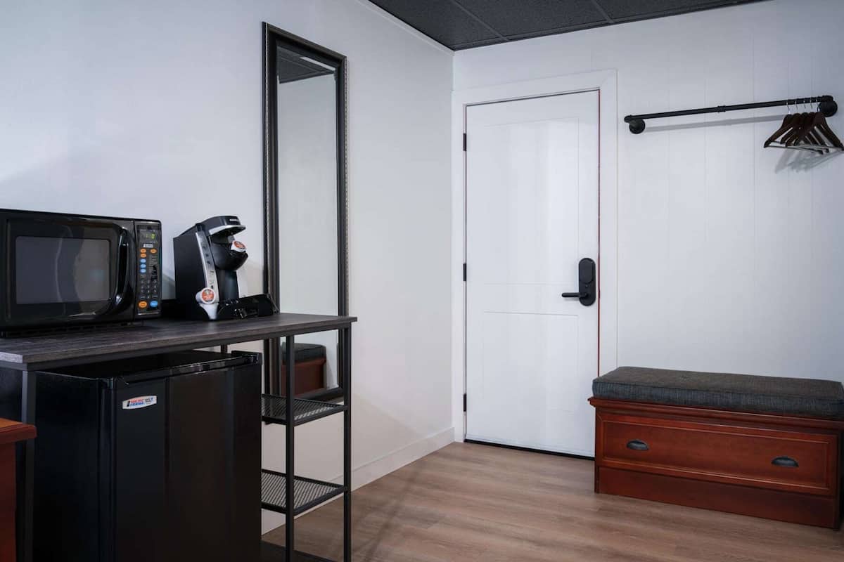 deluxe room, 1 king bed with sofa bed | blackout curtains, iron/ironing board, free wifi, bed sheets