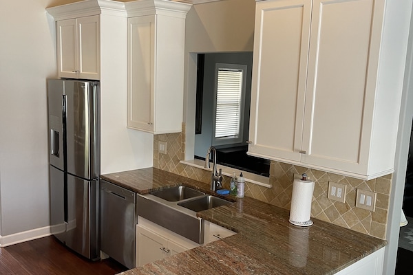 Kitchen with stainless steel appliances throughout