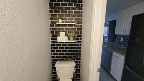 Combined shower/tub, hair dryer, towels, soap