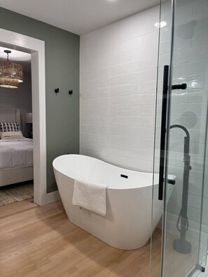 Bathtub, hair dryer, towels, soap