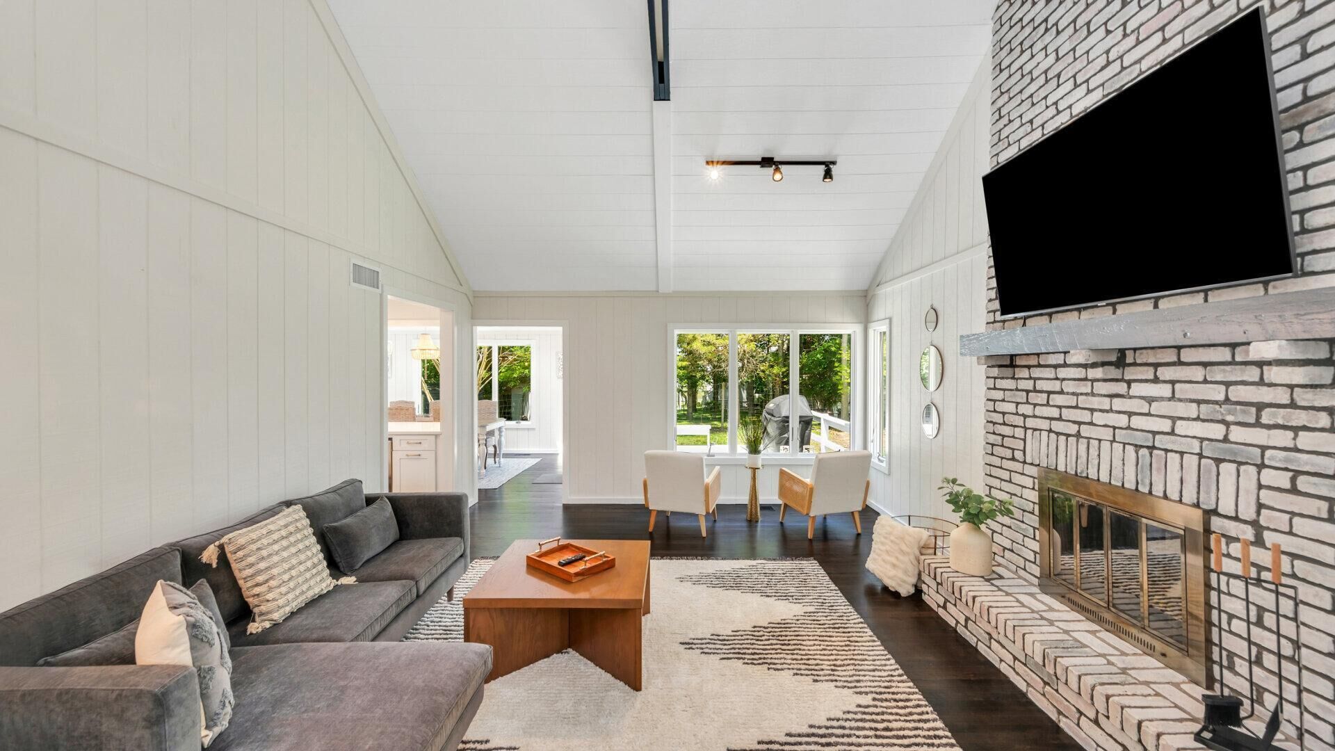 House, Multiple Beds (Escape by Gardiners Bay) | Living area | TV, fireplace