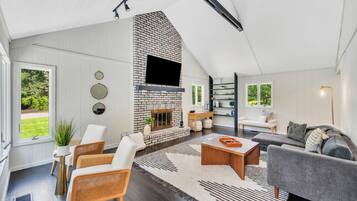 House, Multiple Beds (Escape by Gardiners Bay) | Living area | TV, fireplace