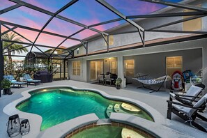 A swimming pool with a glass ceiling, lounge chairs, and a hammock. - There is no other place you want to be than here. (Davenport)