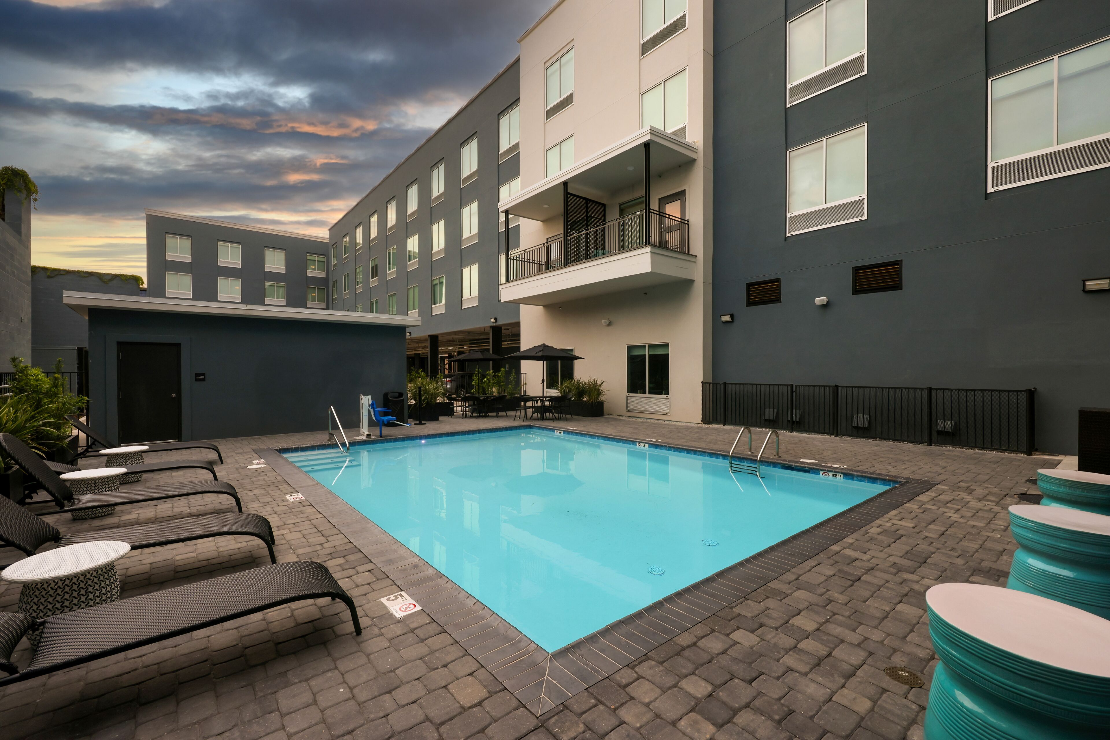 Seasonal outdoor pool, open 9:00 AM to 9:00 PM, pool umbrellas