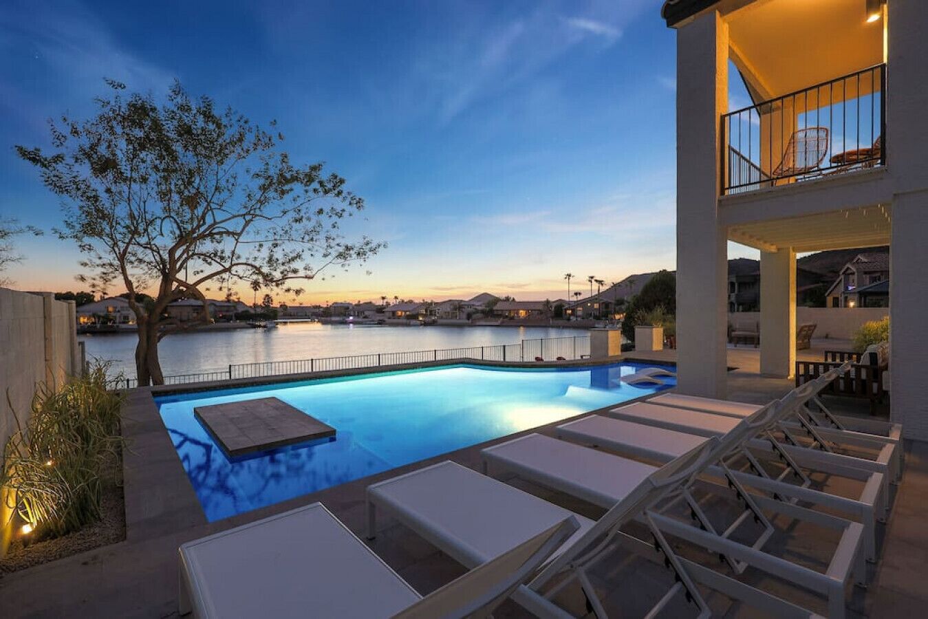 A heated pool, sun loungers