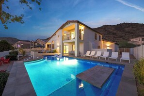 A heated pool, sun loungers