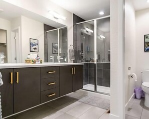 Combined shower/tub, hair dryer, towels, soap