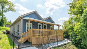 A two-story house with a wooden deck and a covered porch. - This house is a 2 bedroom(s), 1 bathrooms, located in Frankfort, KY. (Frankfort)