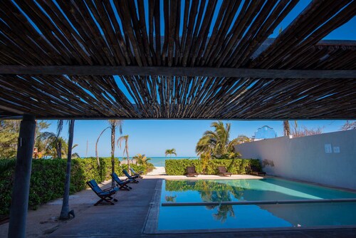 Beachfront 3 BR + Maid Room Modern Condo Private Pool Steps to the Beach