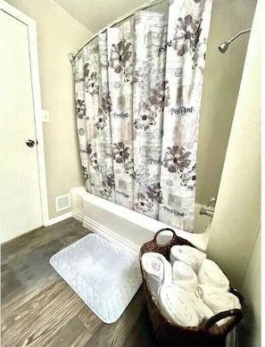 Combined shower/tub, hair dryer, soap, toilet paper