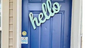 A blue door with the word "hello" in white letters. - Gorgeous 2 bedroom in little Bohemian Omaha (Omaha)