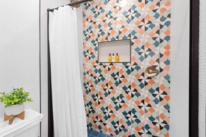 Shower, hair dryer, towels, shampoo