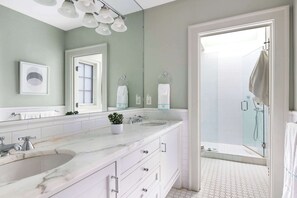 Shower, hair dryer, towels, shampoo