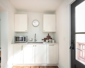 Fridge, microwave, stovetop, coffee/tea maker