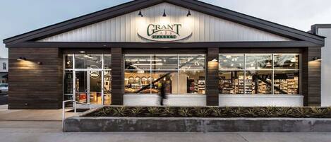 A modern building with a sign reading "Grant Park Markets".