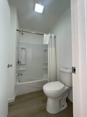 Bathtub, hair dryer, towels