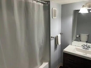 Combined shower/tub, hair dryer, towels, soap