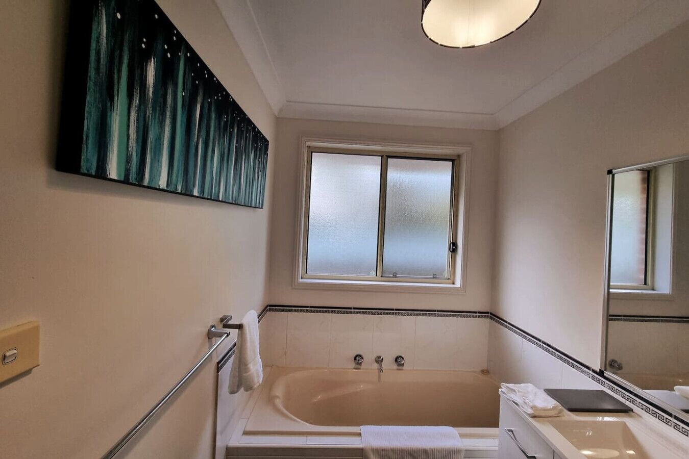 Combined shower/bathtub, hair dryer, towels, soap