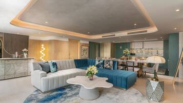 The Penthouse Two Bedroom Suite | Living area | 55-inch LED TV with cable channels, TV