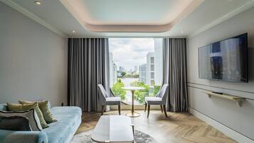 One Bedroom River View | Living area | 55-inch LED TV with cable channels, TV