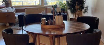 B&B with 2 rooms, a guest washroom, private media room, shared living & kitchen.