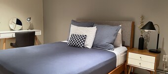 B&B with 2 rooms, a guest washroom, private media room, shared living & kitchen.