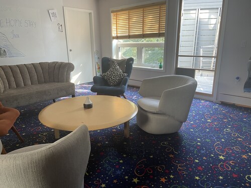 B&B with 2 rooms, a guest washroom, private media room, shared living & kitchen.