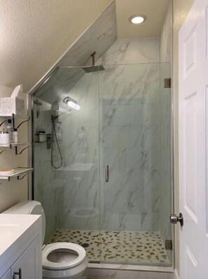 Shower, hair dryer, towels, soap